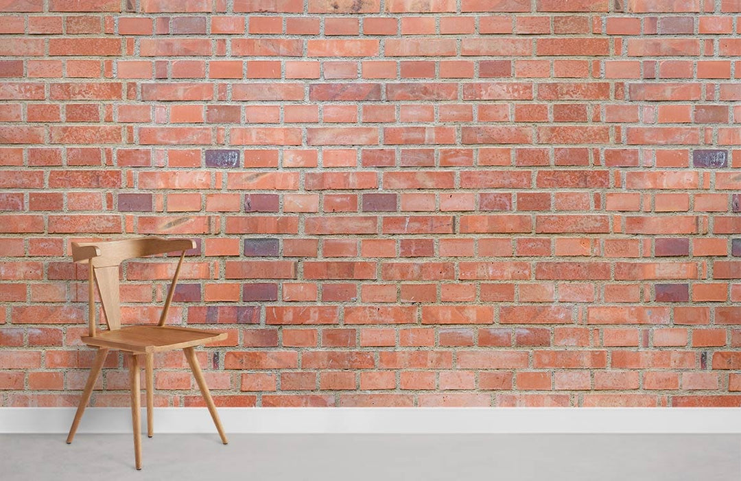 Rustic red brick wallpaper on industrial wall with wooden chair, grey flooring in living room.