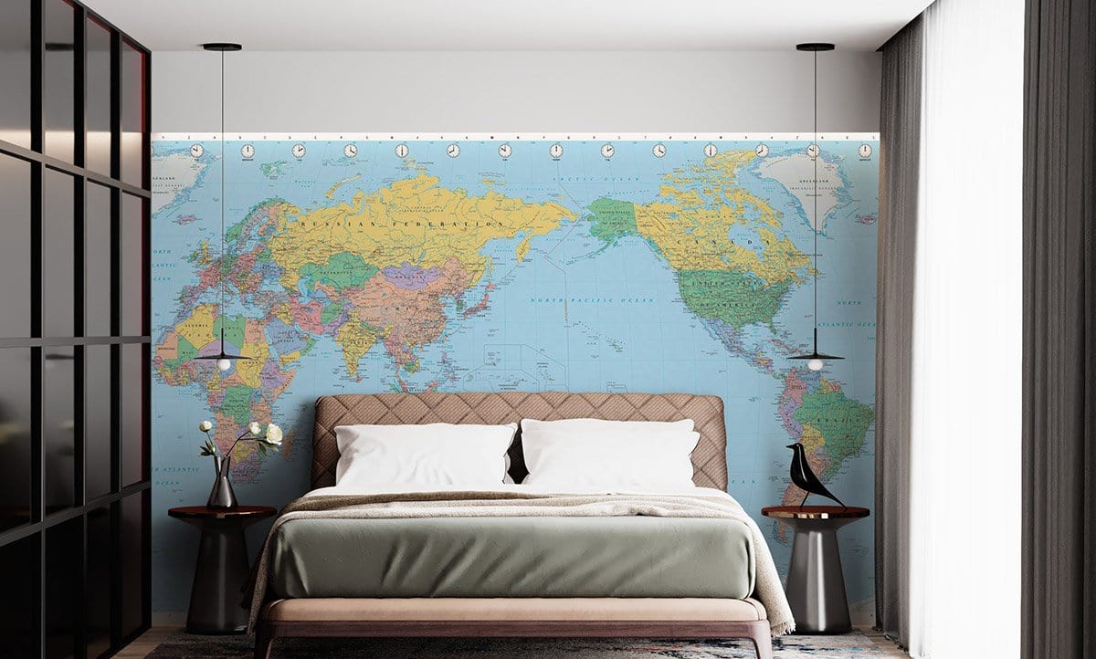 Bedroom with Vintage World Map Mural Wallpaper, taupe bed, modern side tables, and pendant lights.