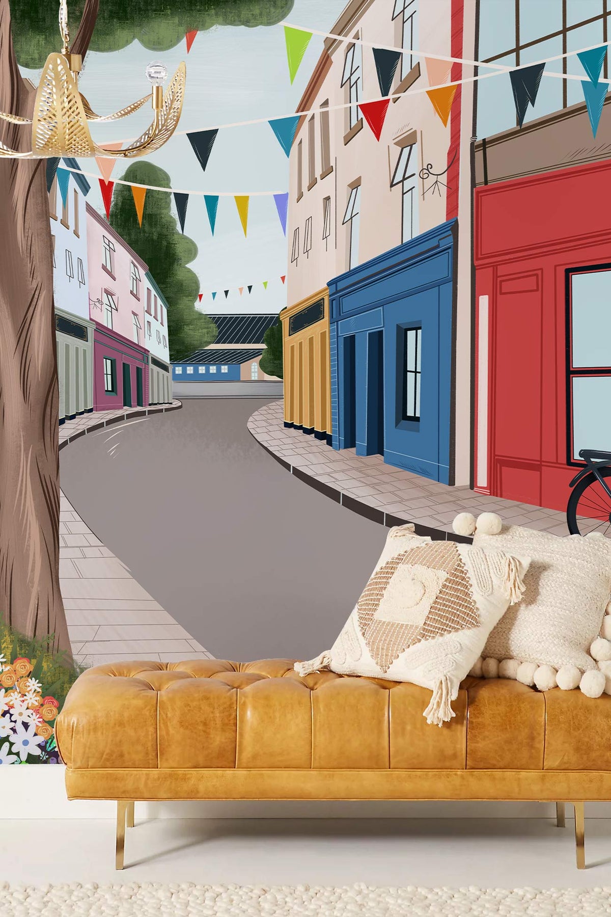 Charming Multicolour Vintage Village Mural Wallpaper, tan leather sofa, cosy interior, colourful street scene.