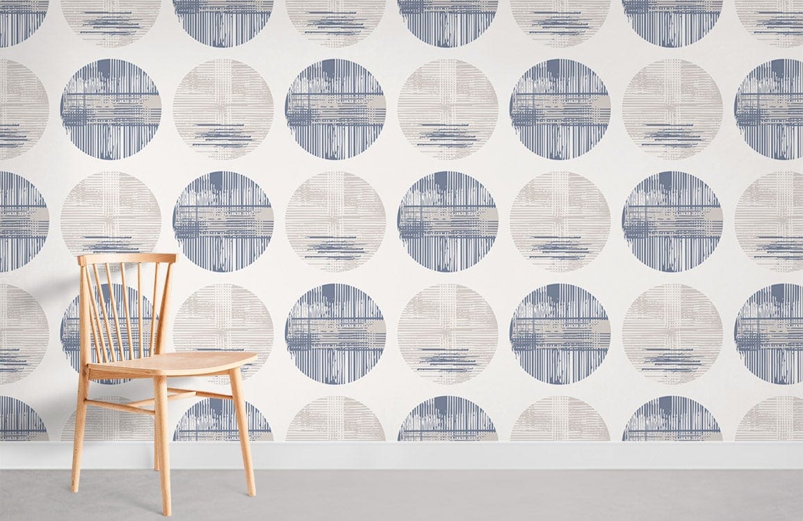 Modern geometric circles wallpaper in blue and beige; wooden chair, grey flooring, contemporary design.