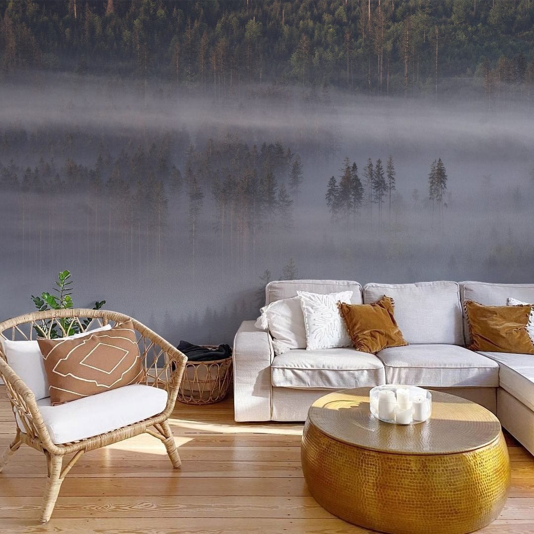 Misty Forest Landscape Mural Wallpaper complements cosy beige sofa and round metallic coffee table, wooden flooring.