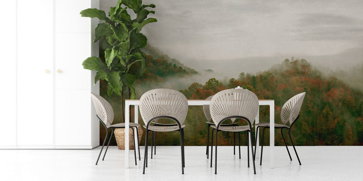 Dining room with Autumn Mist Mountainscape Mural Wallpaper, white table, grey chairs, contemporary design.