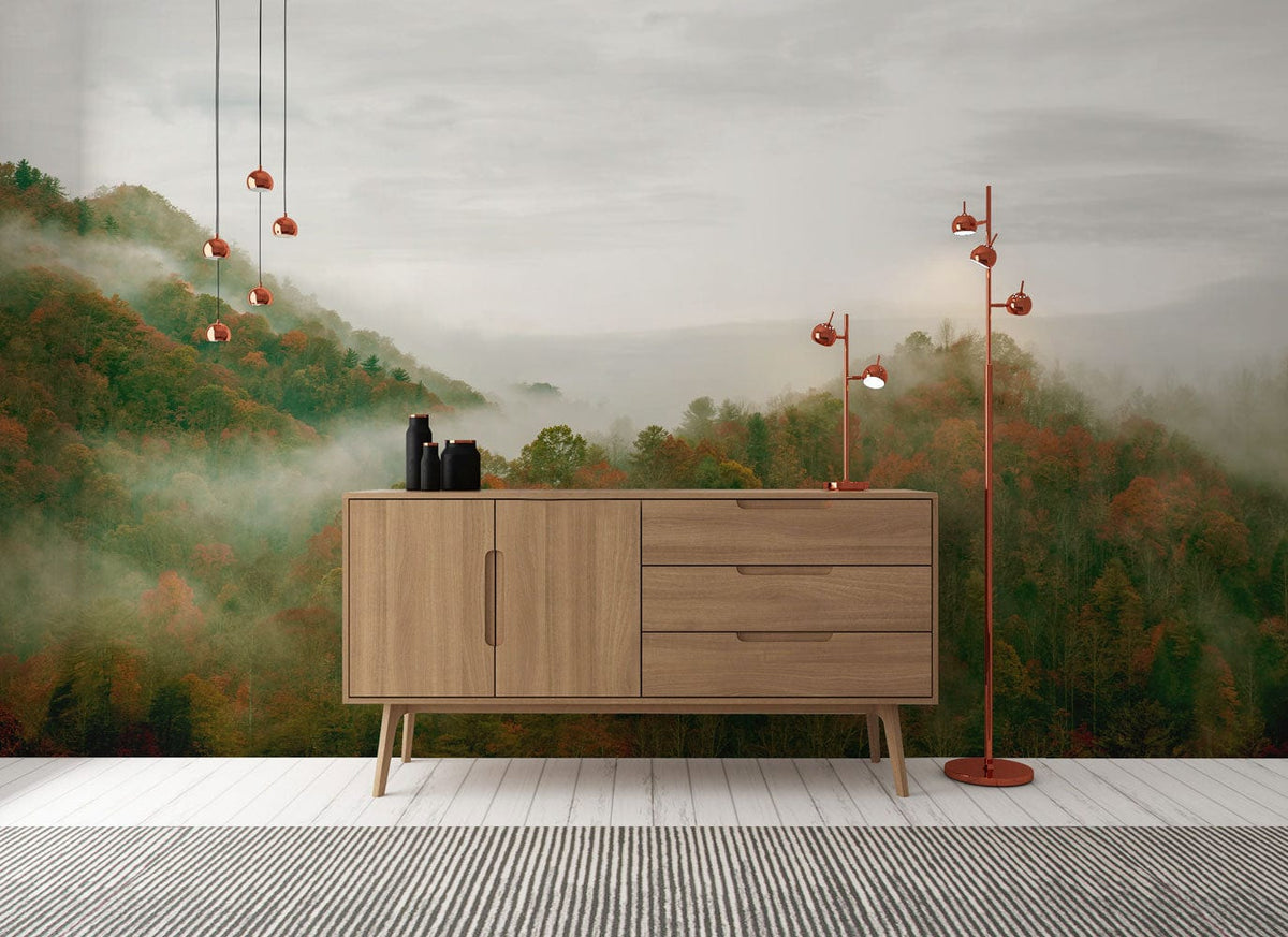 Autumn Mist Mountainscape Mural with modern wood sideboard, white plank flooring, warm hanging lights.