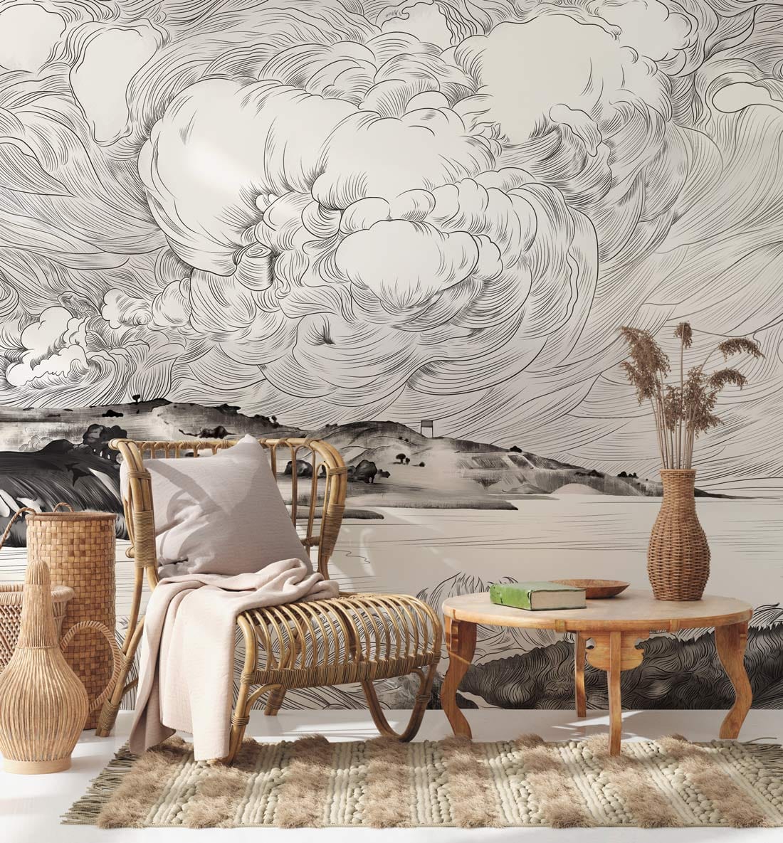 Monochrome coastal landscape mural wallpaper in lounge, with wicker furniture and beige rug. Elegant design.