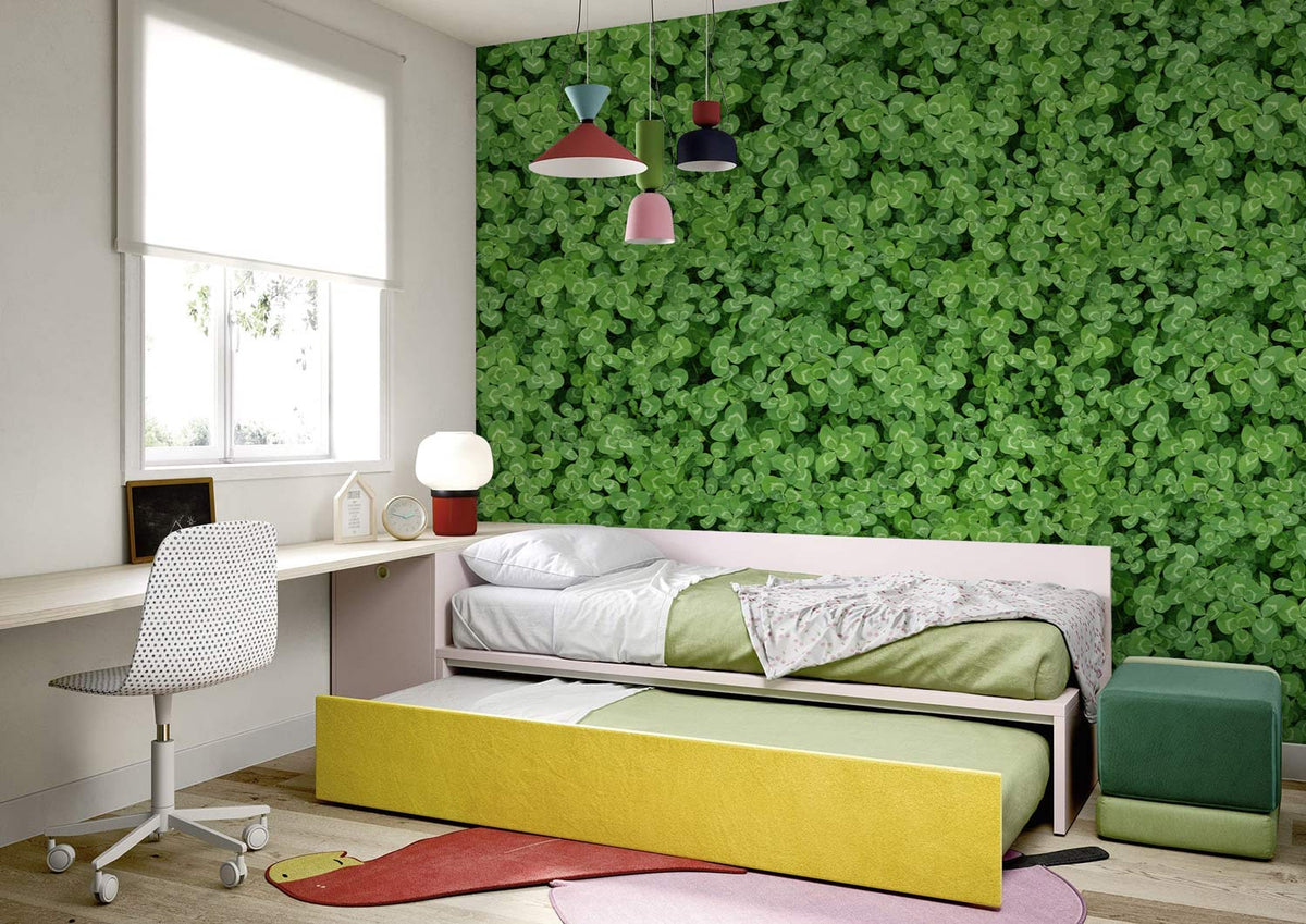 Luxurious green clover wallpaper in cosy bedroom with modern desk, white walls, colourful pendant lights.
