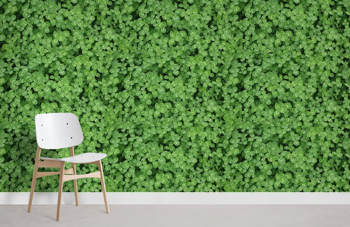 Luxurious green clover botanical wallpaper with chair; elegant home decor, wooden flooring, minimalist design.