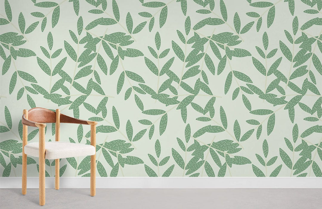 Elegant botanic wallpaper with sage green leaves, modern armchair, white baseboard, light grey flooring.