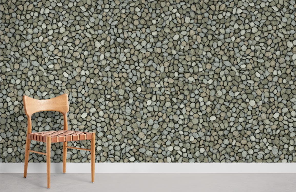 Natural pebble stone wallpaper with wooden chair, grey flooring, ideal for a modern living room.