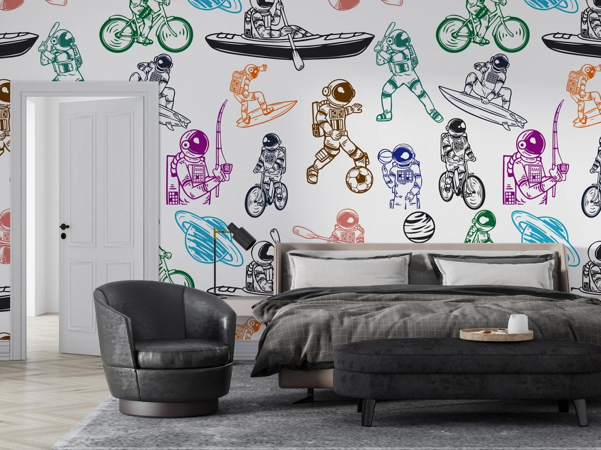 Colourful space adventure mural wallpaper in bedroom with grey bed, black chairs, herringbone flooring.