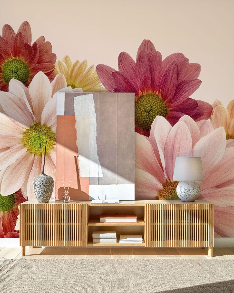 Vintage Floral Daisy Bloom Mural Wallpaper, soft pink, burgundy hues, wooden sideboard, beige carpet, artwork.
