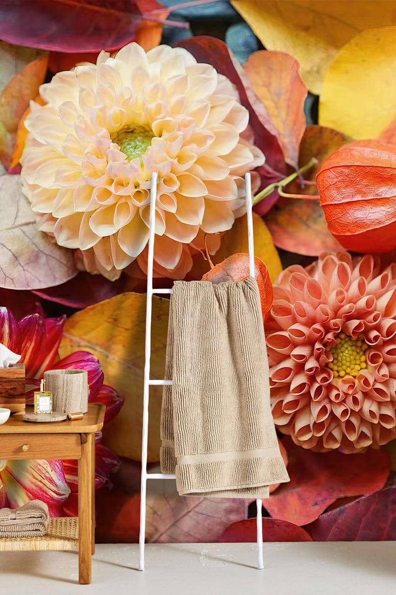 Autumn Blossom Delight wallpaper features vibrant yellow and red floral mural with elegant rattan towel ladder.