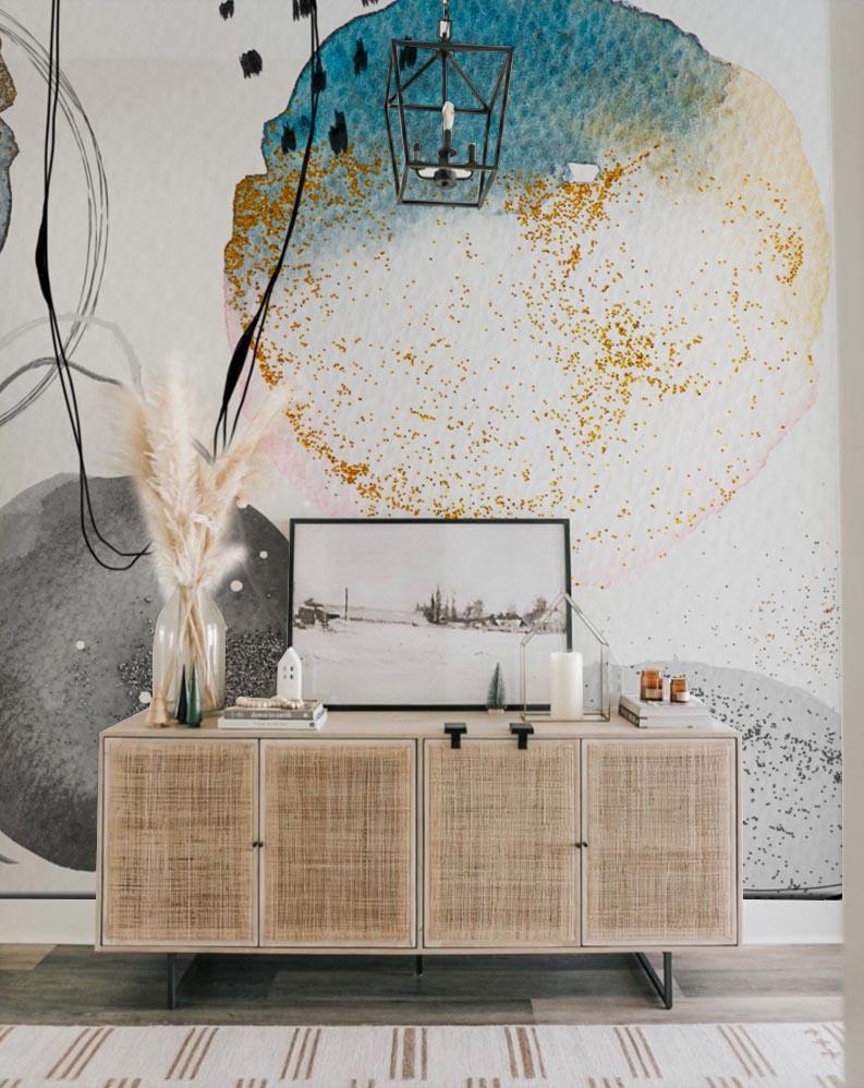 Abstract Watercolour Circles mural in blue, grey, gold tones with sideboard and lantern light fixture.