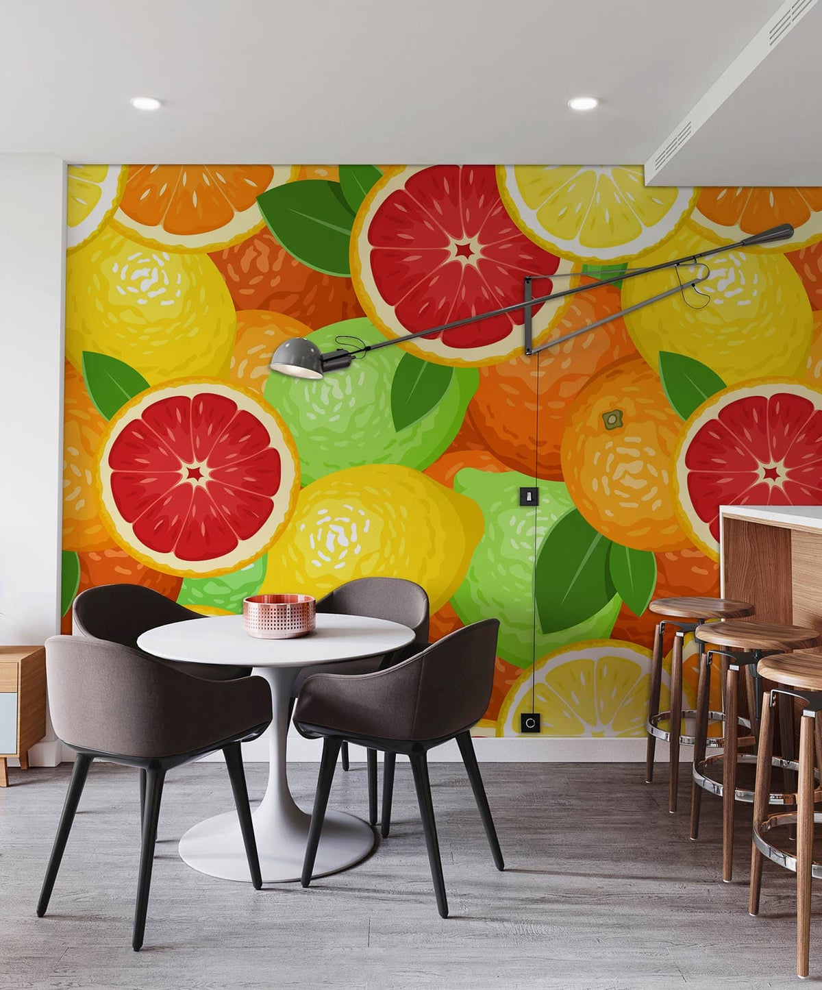 Vibrant citrus fruit wallpaper in modern kitchen with round table, grey chairs, wooden flooring, bar stools.