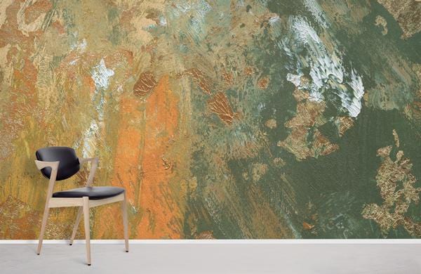 Abstract earthy tones mural wallpaper with gold accents, featuring modern chair on light flooring.