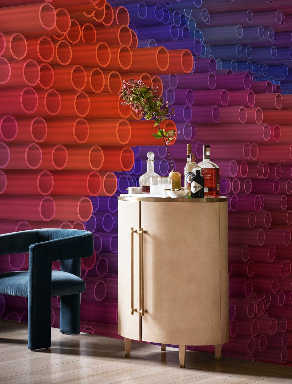 Vibrant 3D Gradient Tubes Mural Wallpaper, velvet armchair, light wood flooring, elegant room setting.