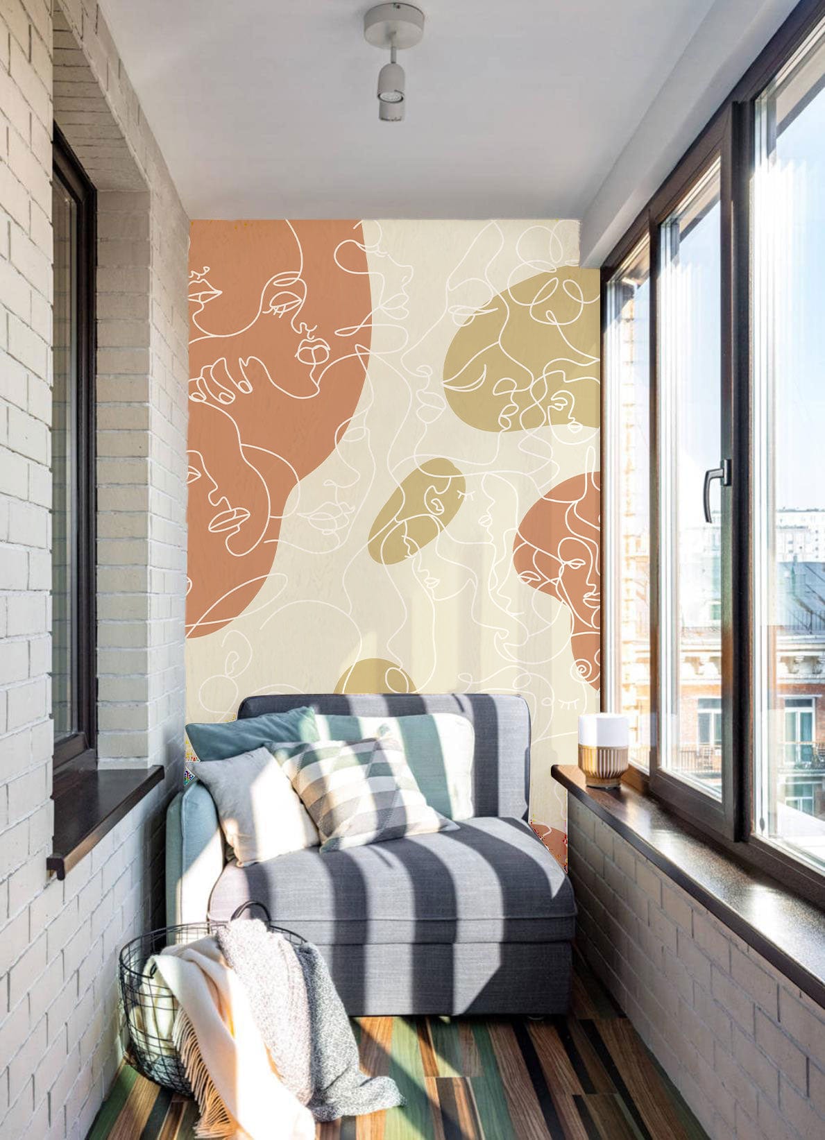 Abstract Pastel Earth Tones Line Art Wallpaper in sunlit room with grey sofa and striped flooring.