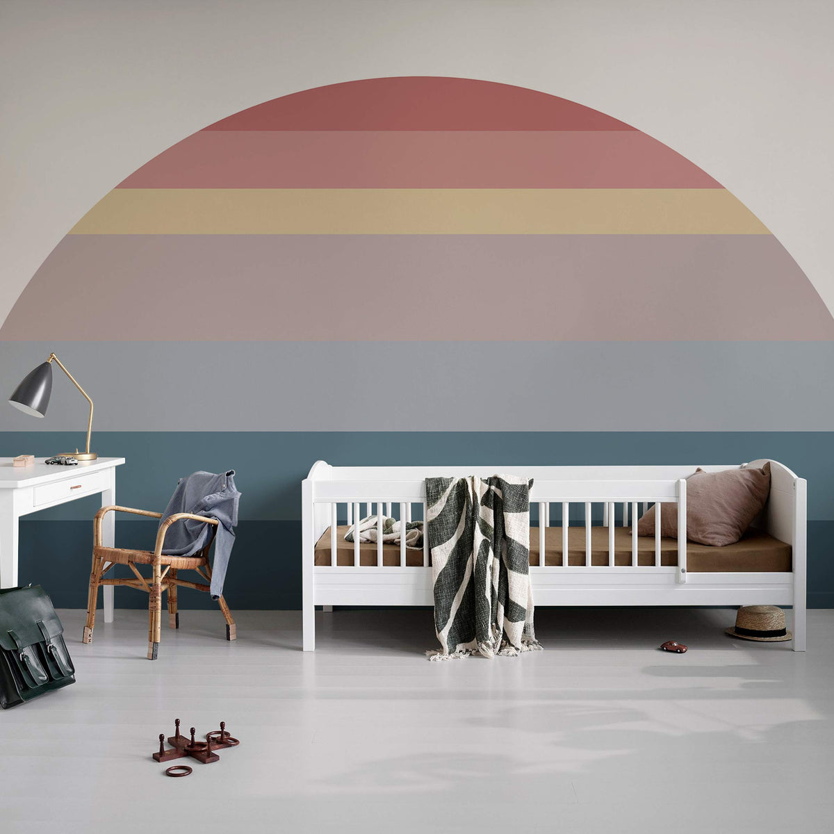 Vintage Sunset Gradient Mural Wallpaper in pastel tones decor, white nursery cot, wooden chair, desk.