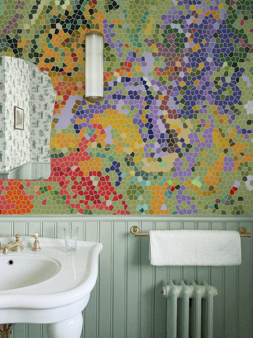 Vibrant Mosaic Mural Wallpaper in bathroom, white sink, light green panelling, unique colourful geometric patterns.
