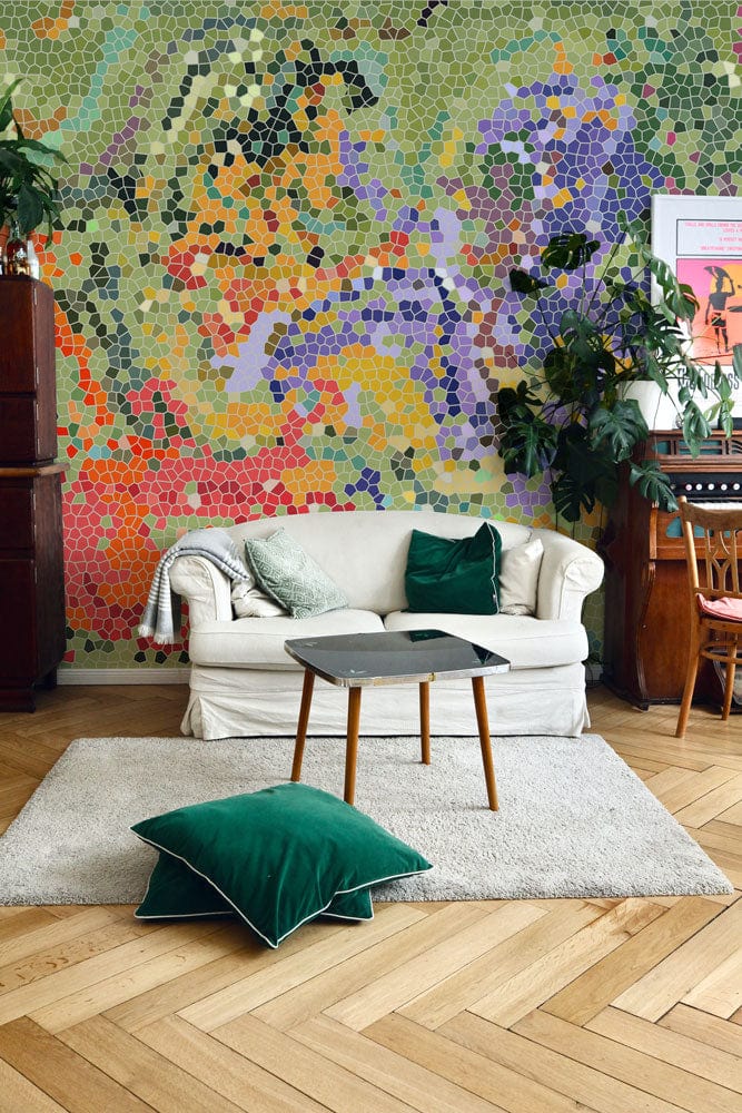 Vibrant mosaic mural wallpaper, cream sofa, green cushions, wooden flooring, elegant living room setting.