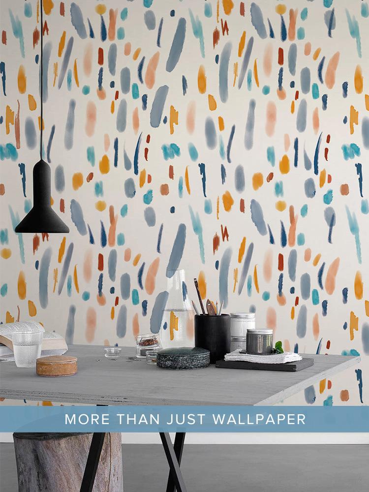 Abstract multicolour brush strokes wallpaper, pastel hues, modern dining area, grey table, pendant light.