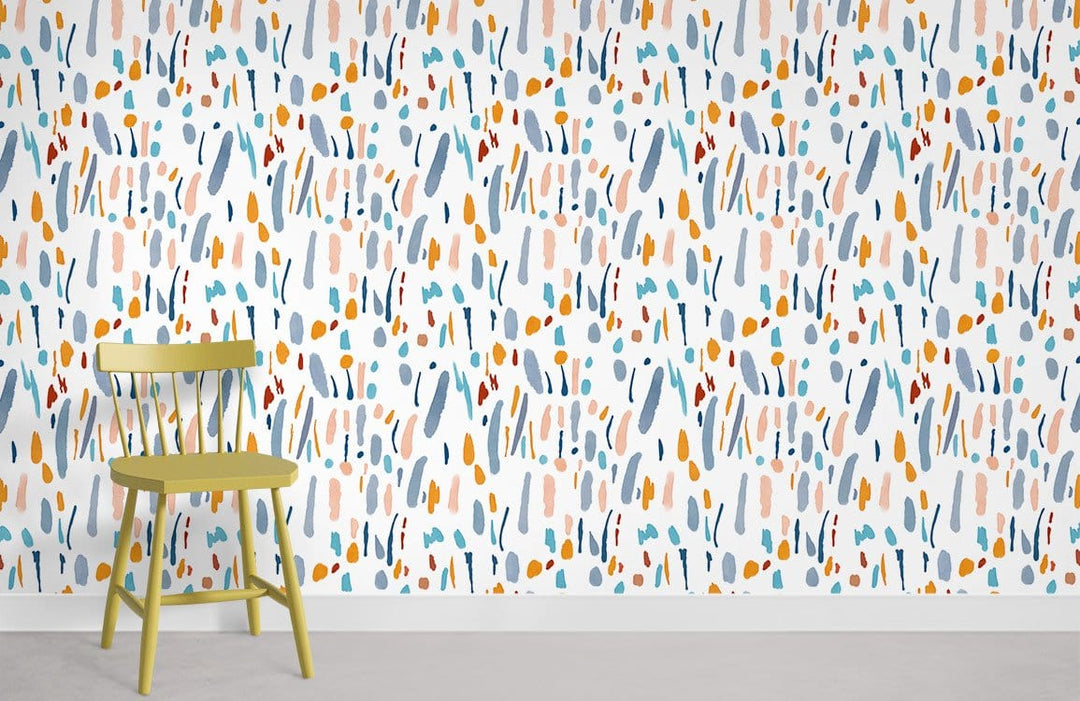 Abstract multicolour patterned wallpaper with pastel brush strokes, complemented by an olive green chair.