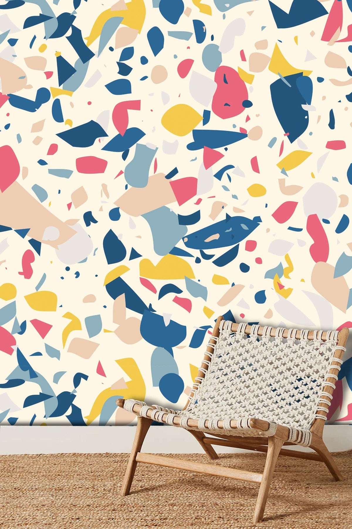 Abstract multicolour terrazzo pattern wallpaper, contemporary woven chair, natural fibre rug, modern interior.