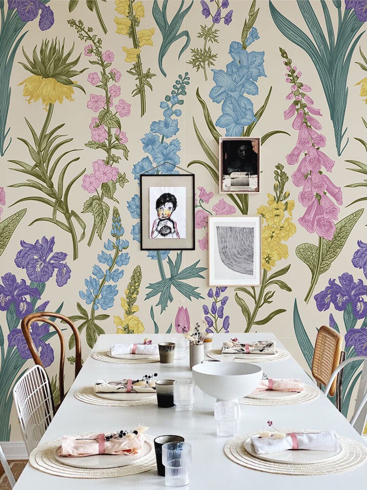 Vintage Floral Meadow Wallpaper in dining room, pastel botanical design, white table, eclectic chairs.