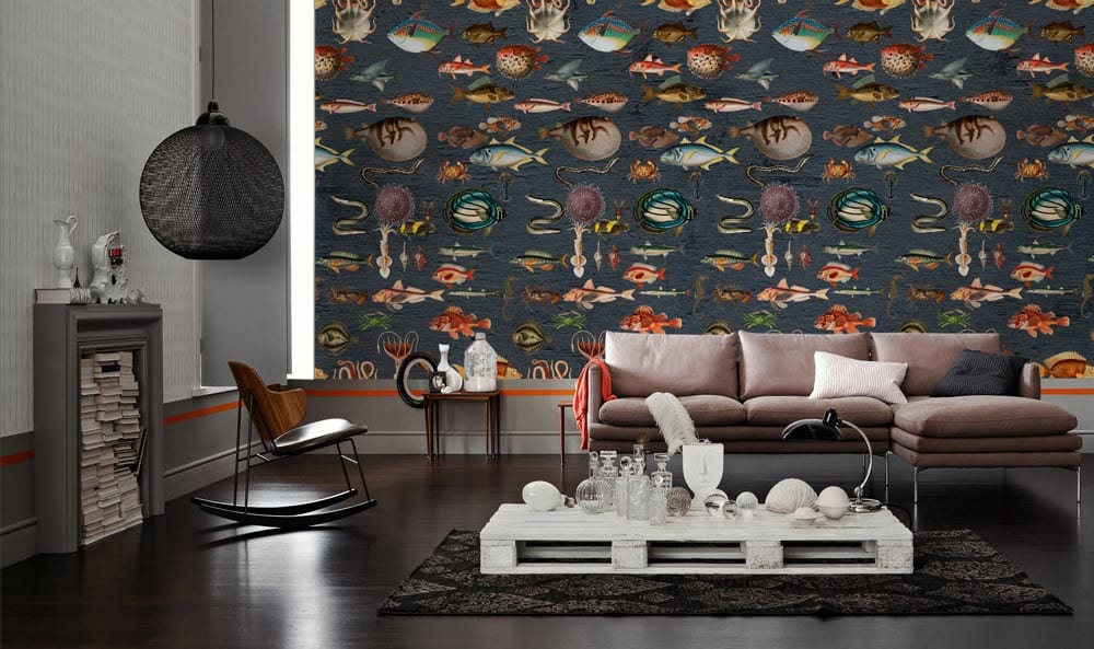 Undersea Adventure Marine Wallpaper Mural in living room with grey sofa, dark wood floors, pendant light.