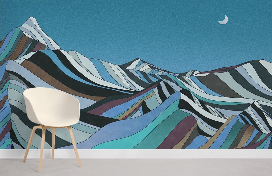 Moonlit Mountain Landscape Mural Wallpaper in Teal, Earthy Tones; white chair, minimalist room, light flooring.