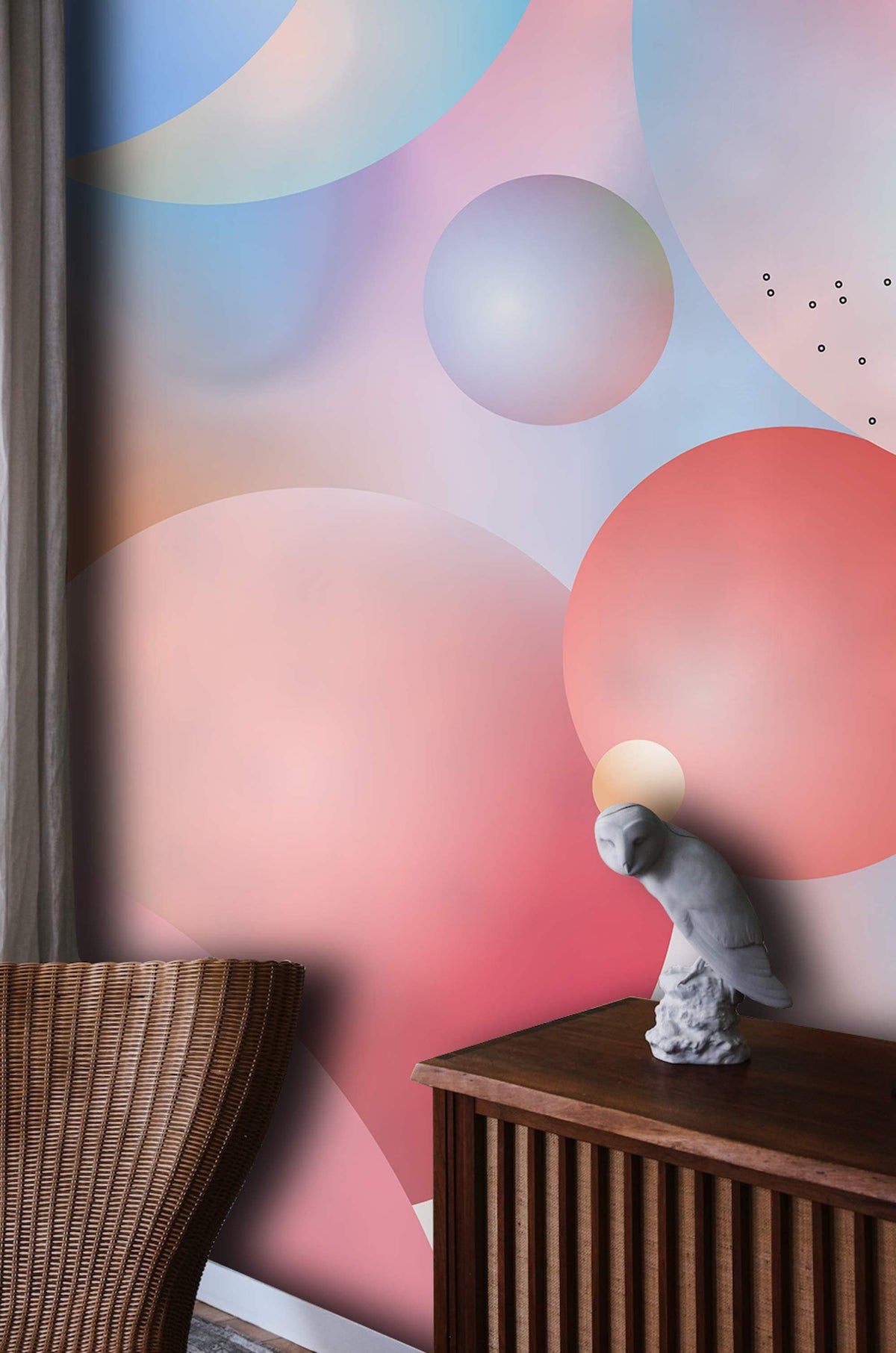 Pastel Bubble Dreamscape mural wallpaper with wooden chair, rattan sideboard, soft multicoloured hues.