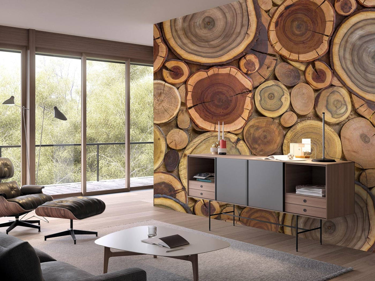 Rustic wood slice wallpaper, earthy tones, modern living room, wood flooring, grey armchair and sofa.