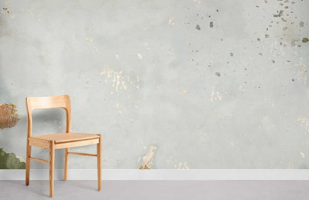 Chair against vintage soft blue distressed texture wall mural with rustic charm decor style.