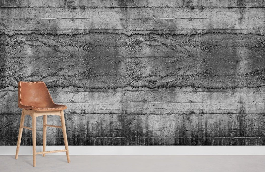 Industrial grey concrete textured wallpaper in urban style with brown leather chair; modern interior setting.