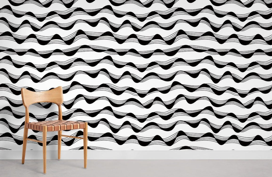 Modern monochrome wavy lines wallpaper with wooden chair, grey flooring, in a contemporary room setting.