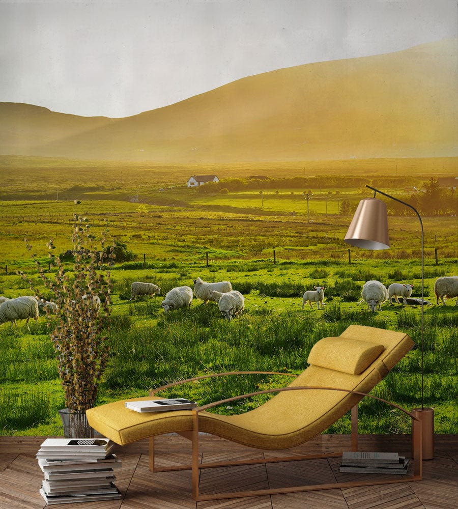 Tranquil Green Countryside wallpaper with sheep, yellow chaise longue, modern lamp, wooden flooring.