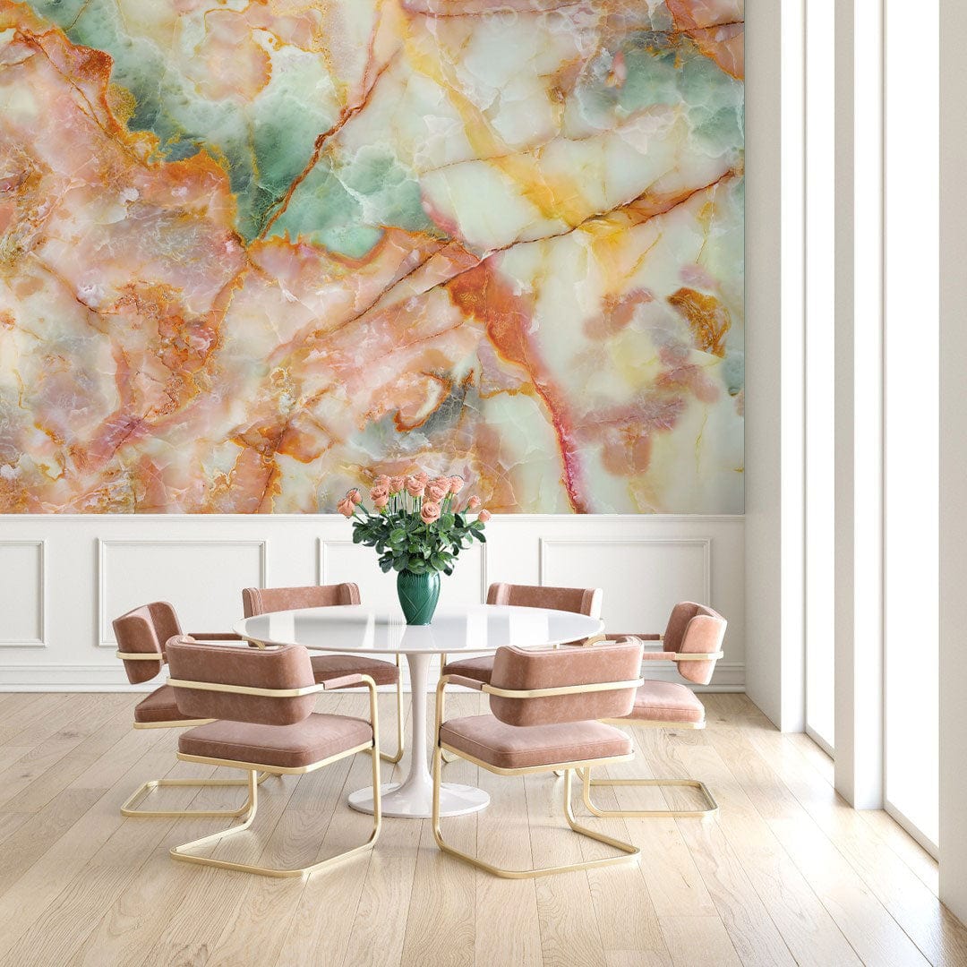 Colourful marble effect wallpaper in elegant dining room with pink chairs, round table, wooden flooring.