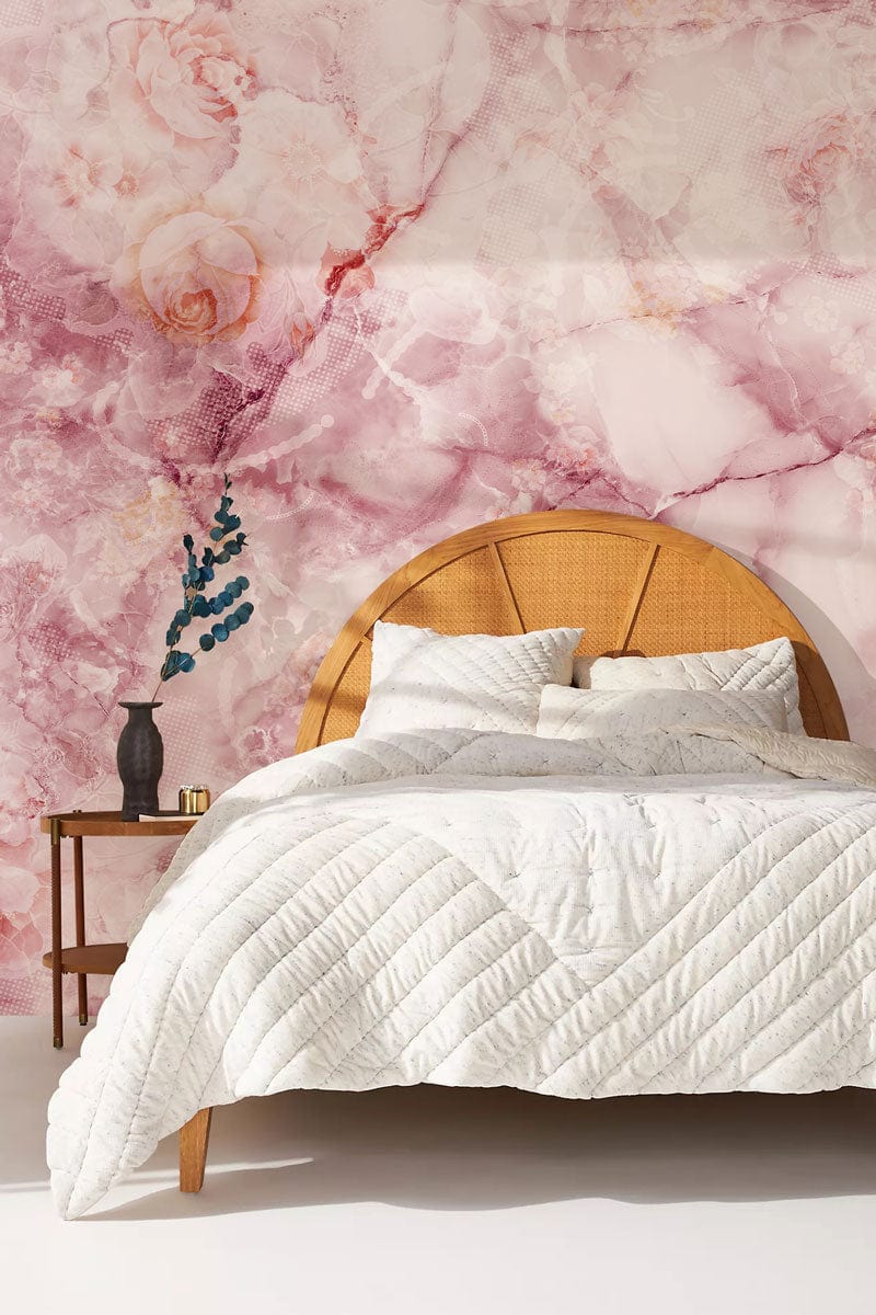 Vintage rose marble wallpaper with elegant floral design, wooden headboard, white bedding, and side table.