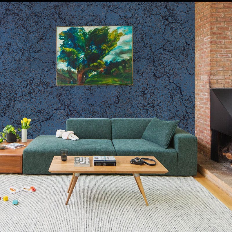 Midnight Blue Crackle Textured Wallpaper, green sofa, brick fireplace, contemporary living room design.