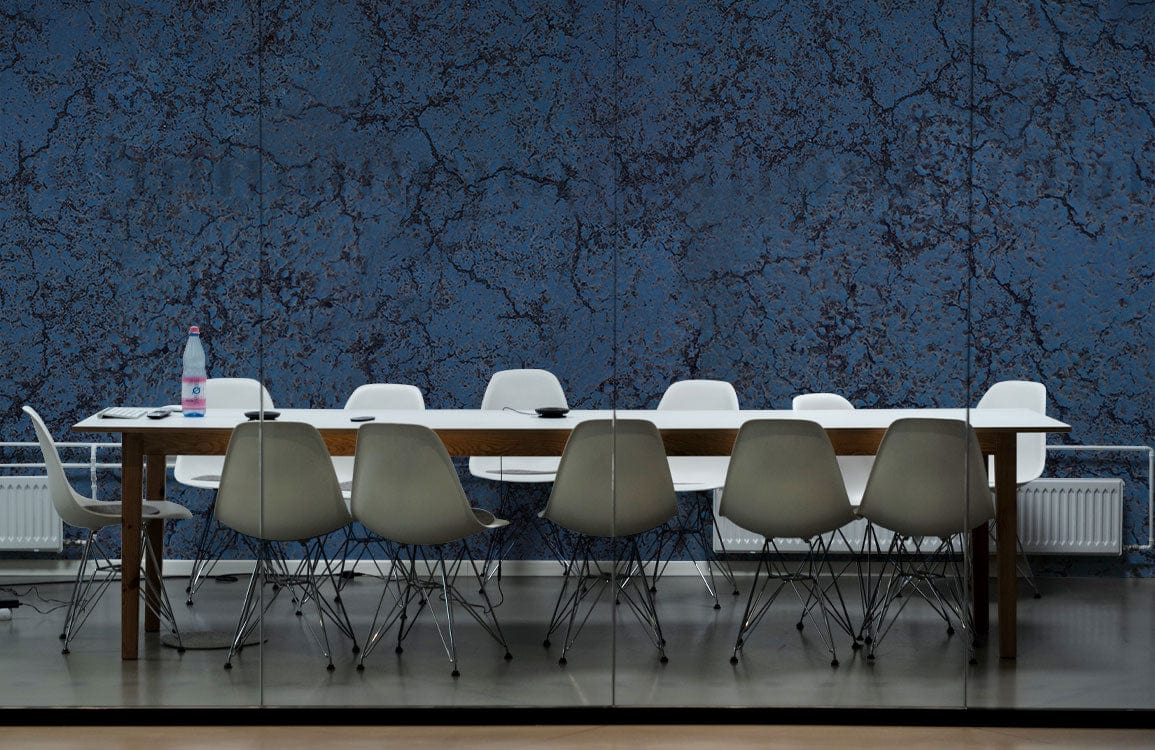 Midnight Blue Crackle Textured Wallpaper, contemporary meeting room, white chairs, wooden table, concrete flooring.