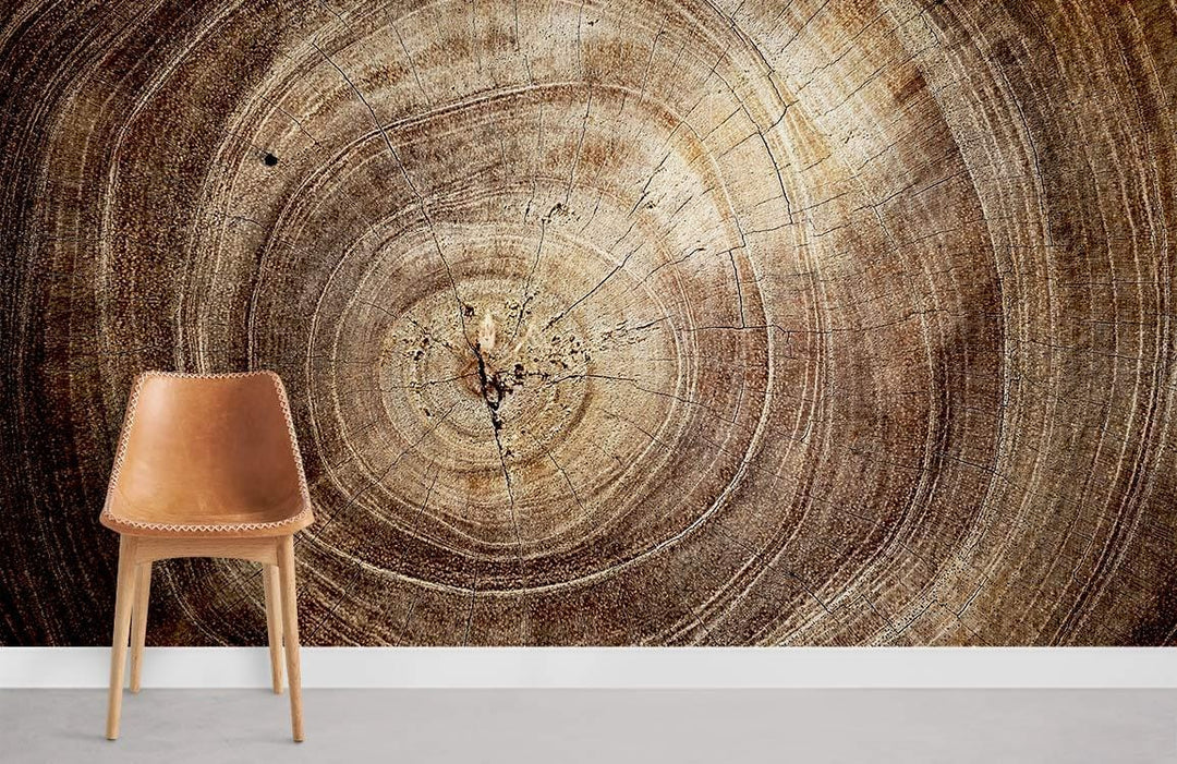 Natural woodgrain texture wallpaper with brown tree rings, featuring a leather chair on grey flooring.