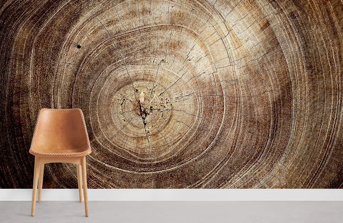 Natural woodgrain texture wallpaper with brown tree rings, featuring a leather chair on grey flooring.