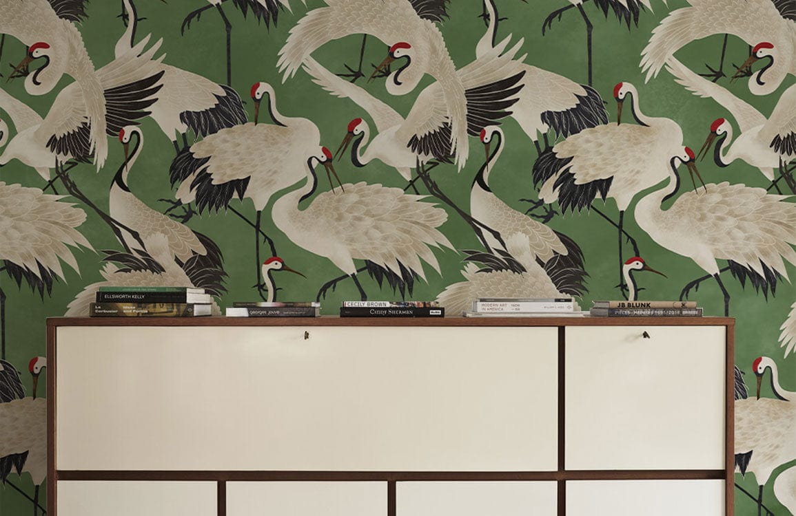 Elegant green crane wallpaper with mid-century sideboard in living room decor; timeless oriental style.