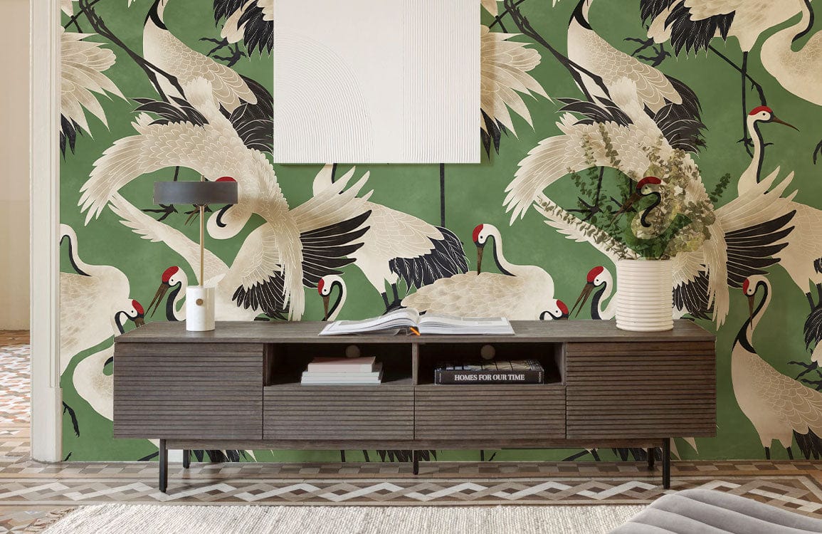 Elegant green crane wallpaper, dark wood credenza, monochrome lamp, geometric floor, stylish room decor.