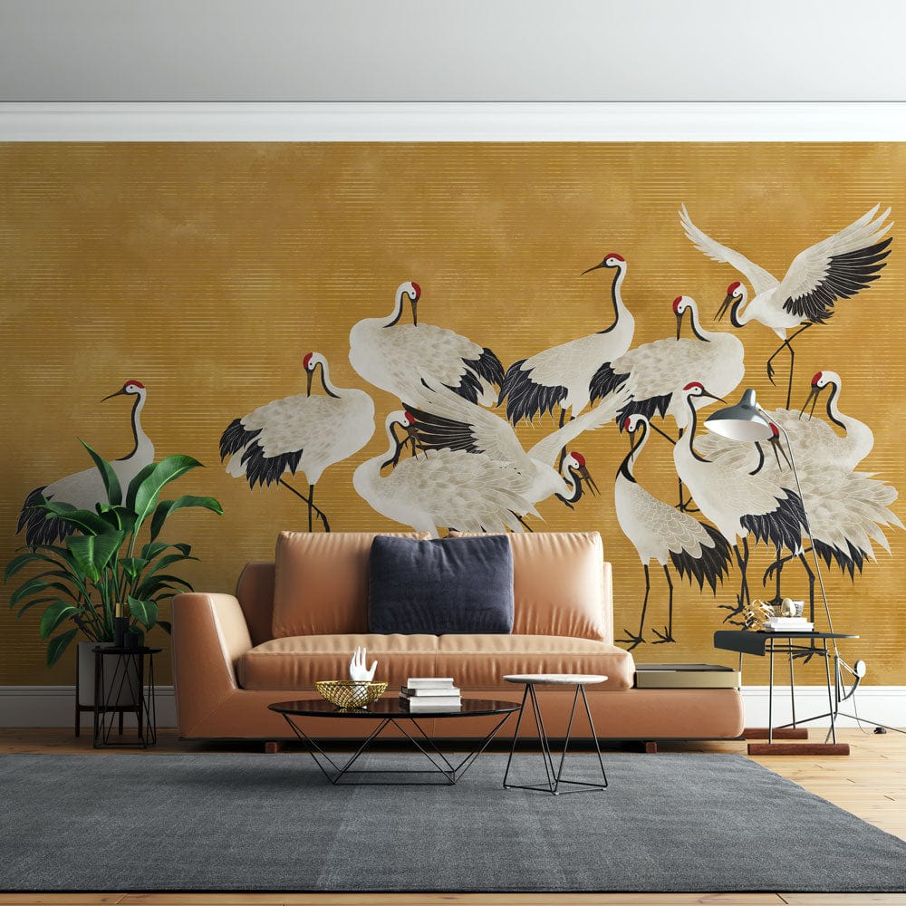 Elegant Golden Crane Mural on wall; brown sofa; grey rug; wood flooring; living room setting.