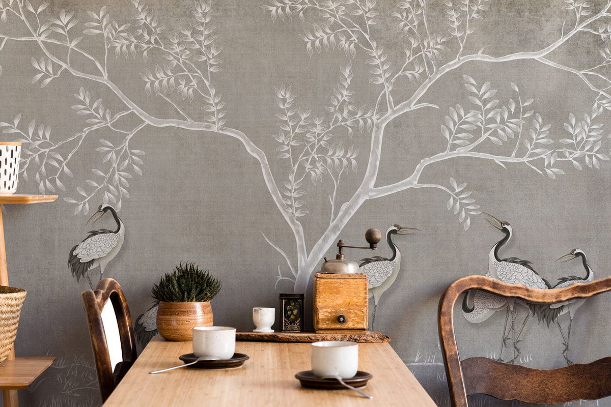 Elegant grey mural wallpaper in dining room with wooden table, chairs, and nature-inspired crane design.