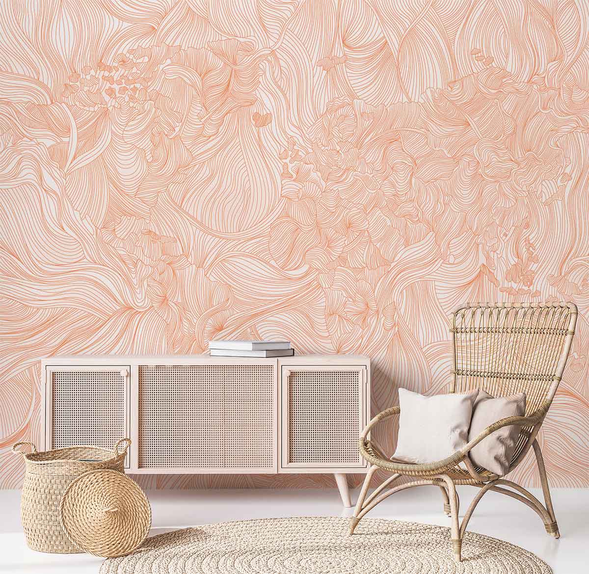 Elegant peach floral swirl pattern wallpaper with wicker chair, beige sideboard, round rug, and baskets.