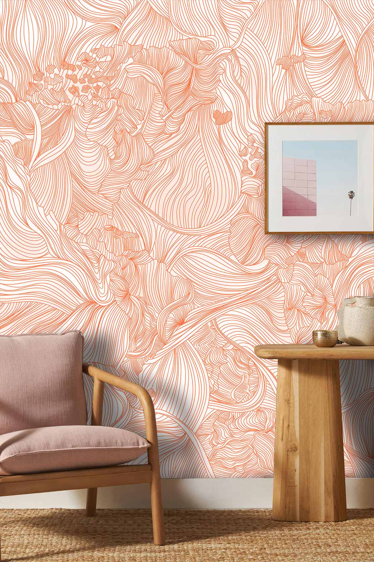 Elegant peach floral swirl textured wallpaper in lounge with wooden chair, woven rug, wooden table, artwork.