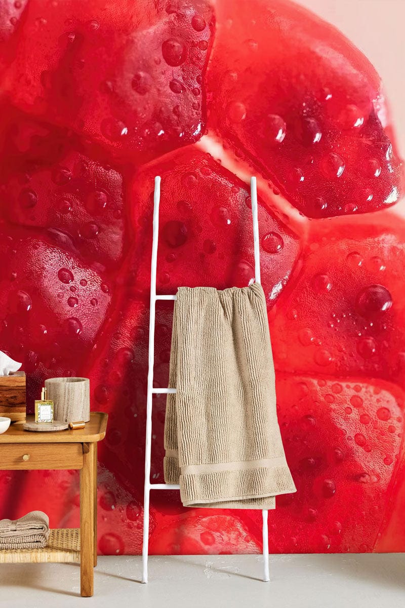 Vibrant pomegranate red textured wallpaper, modern decor; wooden bench and towel rack; beige towel.