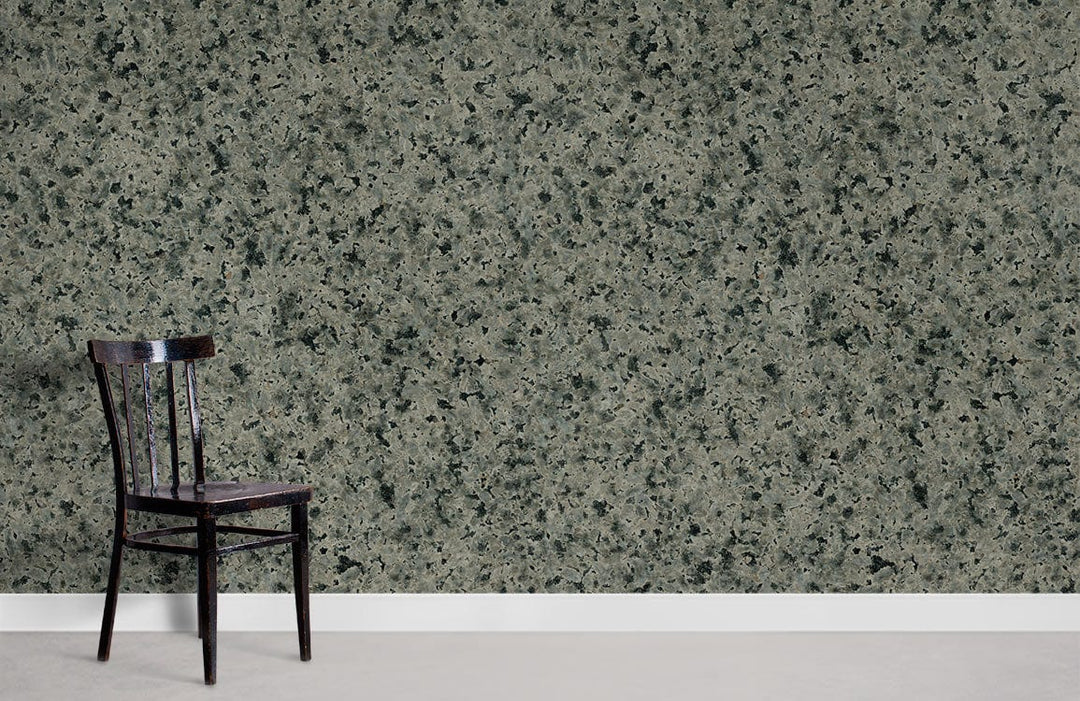 Elegant grey granite textured wallpaper enhances modern design with sleek black chair and minimalist style.