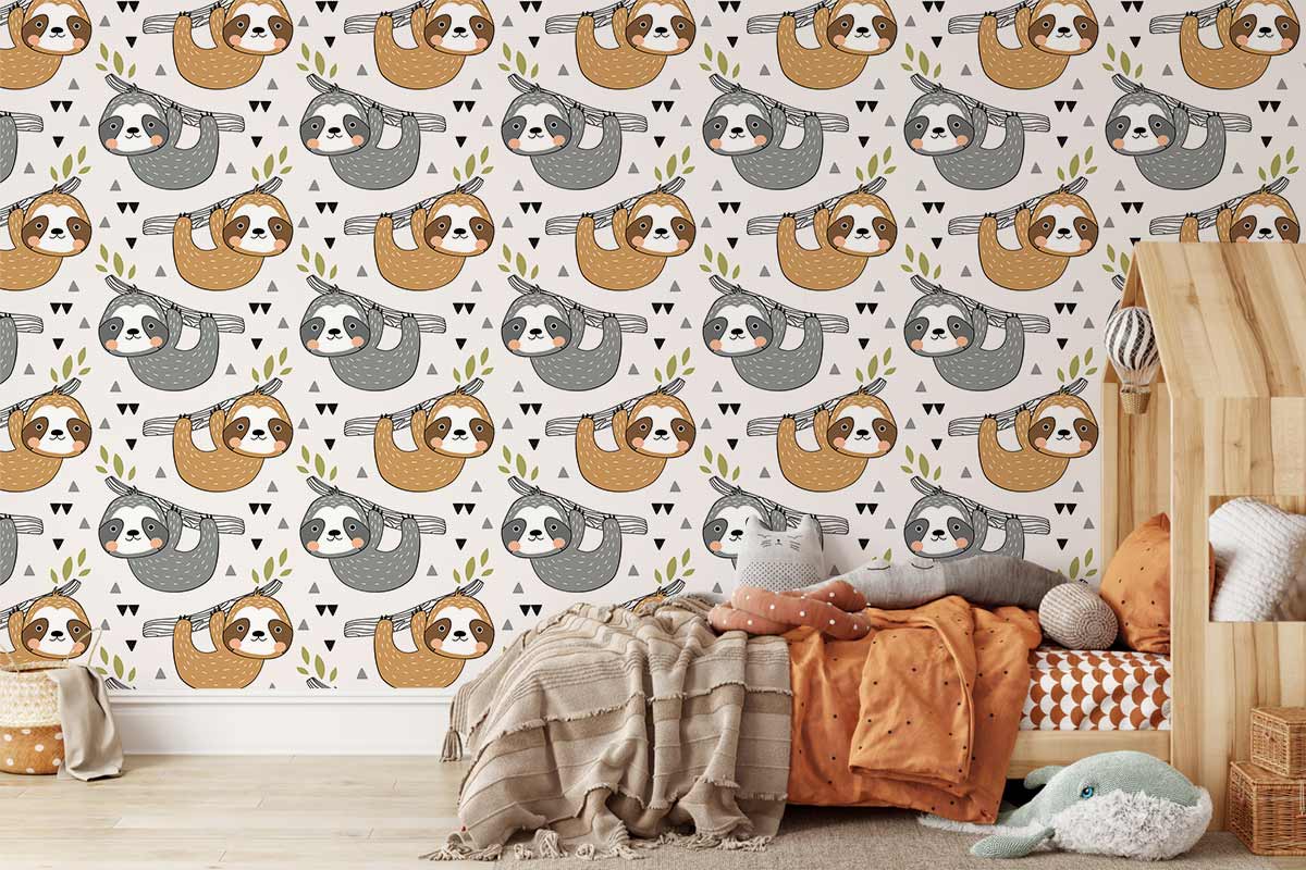 Cosy children's room with Whimsical Sloth Wallpaper, wooden floor, neutral furnishings, and colourful cushions.